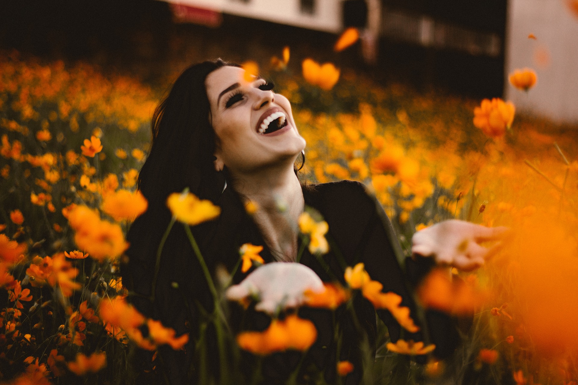 Woman laughing in flower field